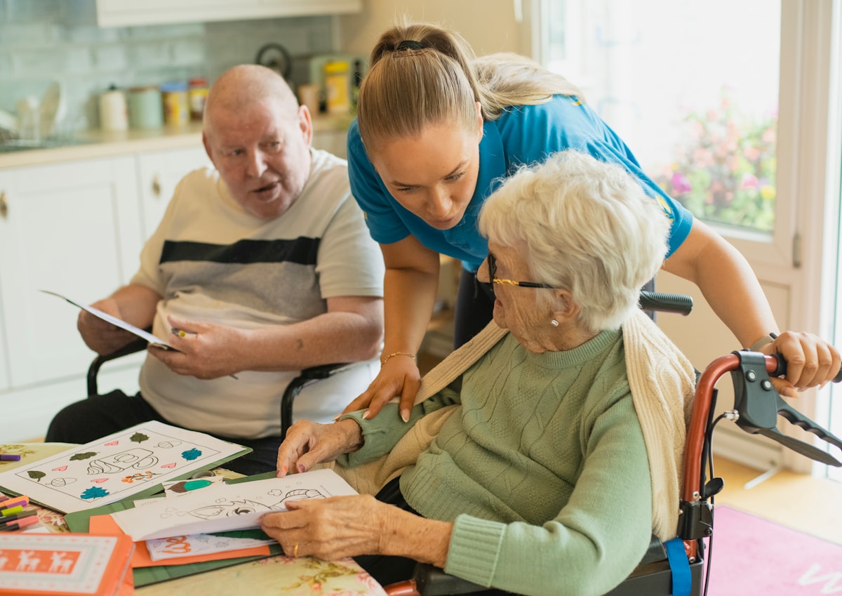 A volunteer helping an elderly community member