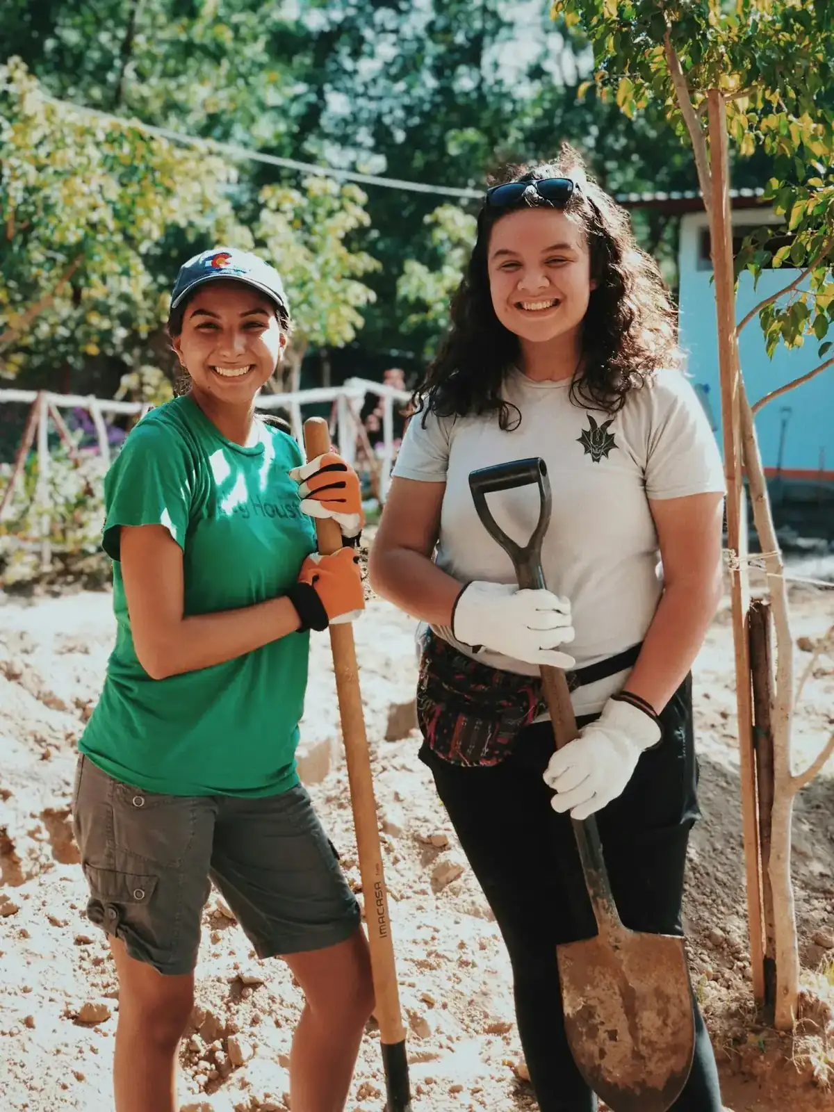 Devicentrix volunteers outdoors with garden tools